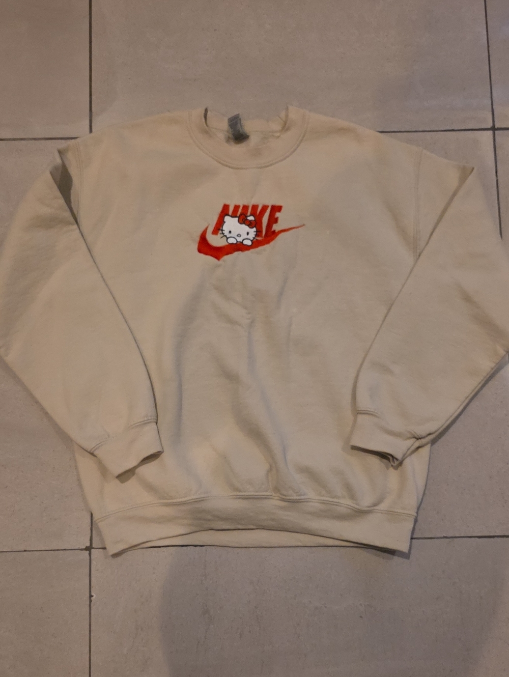 Nike Cream Crewneck Sweatshirt with Red Swoosh and Hello Kitty Graphic
